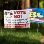 Signs in support of and opposition of the Proposition 1 annexation into RFA are visible along 100th Avenue West on Thursday, April 3, 2025 in Edmonds, Washington. (Olivia Vanni / The Herald)