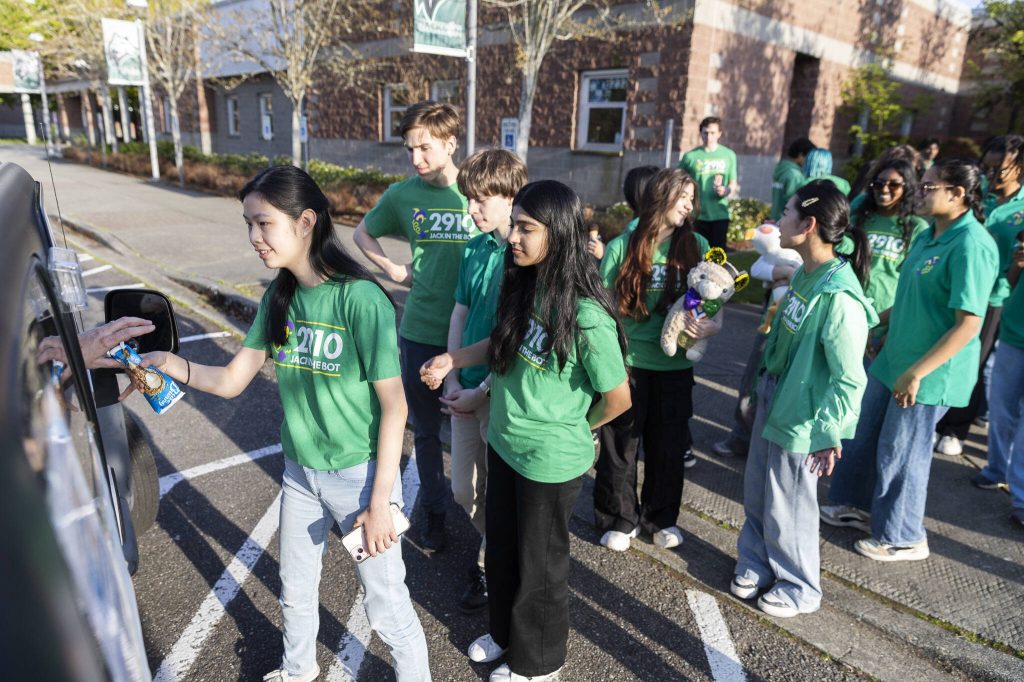 Members of the Team 2910 Jack in the Bot get ice cream as a treat after winning the championship at the FIRST Robotics Competition on Thursday, April 24, 2025 in Mill Creek, Washington. (Olivia Vanni / The Herald)