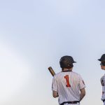 Monroes Caleb Campbell talks with teammate AJ Welch before stepping up to bat during the game against Everett on Wednesday, April 23, 2025 in Monroe, Washington. (Olivia Vanni / The Herald)