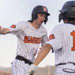Monroes Caleb Campbell high-fives his teammate Mike Enrico after scoring during the game against Everett on Wednesday, April 23, 2025 in Monroe, Washington. (Olivia Vanni / The Herald)