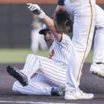 Monroes Brendon Kingsley slides into third base during the game against Everett on Wednesday, April 23, 2025 in Monroe, Washington. (Olivia Vanni / The Herald)
