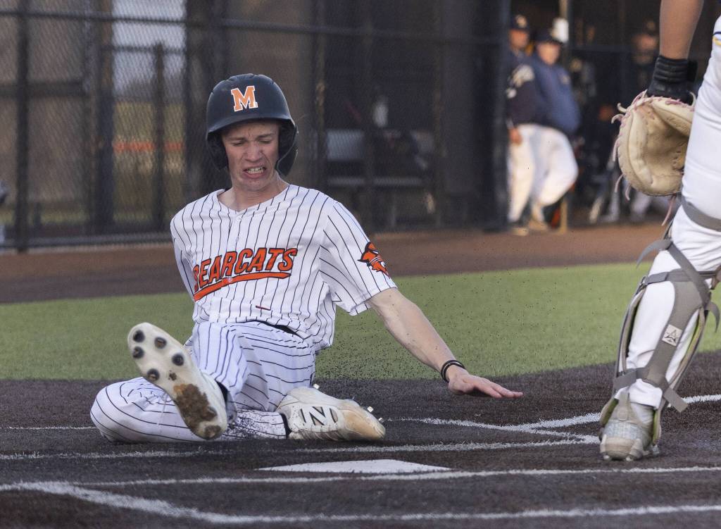 Monroes Caleb Campbell slides into home to score during the game against Everett on Wednesday, April 23, 2025 in Monroe, Washington. (Olivia Vanni / The Herald)