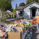 Boxes of food for clients line the back of the church at the Faith Lutheran Food Bank on Friday, April 25, 2025, in Everett, Washington. (Olivia Vanni / The Herald)