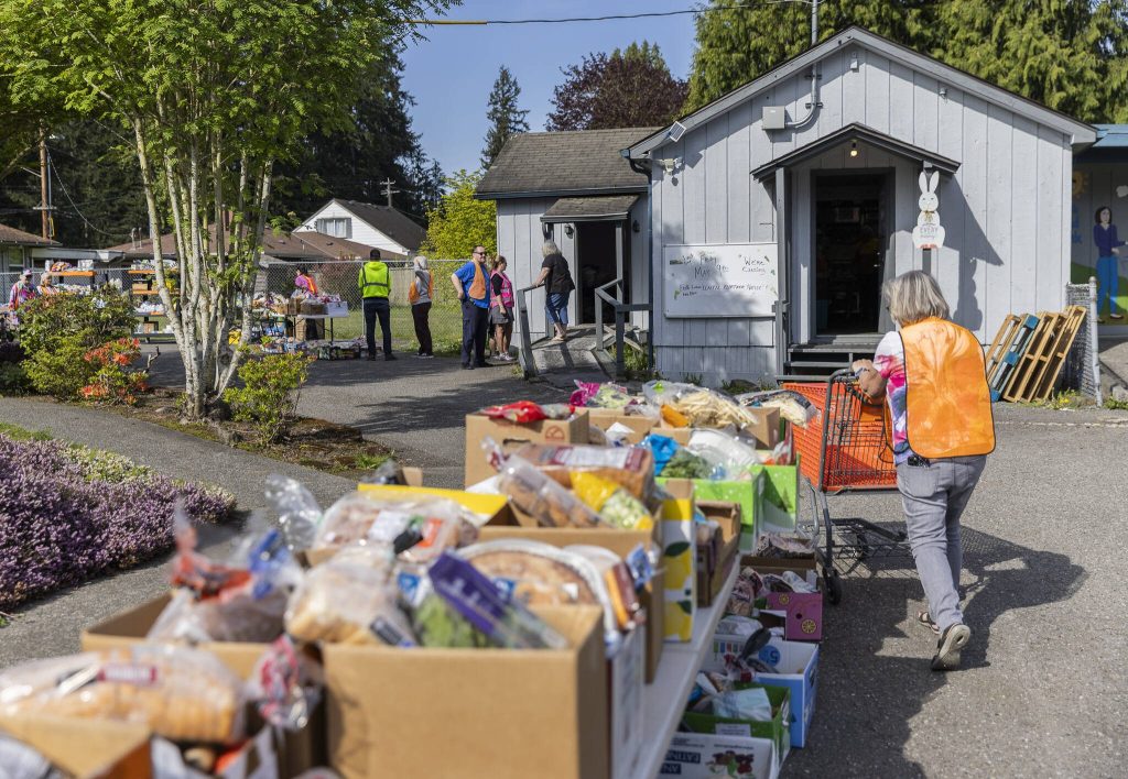 Boxes of food for clients line the back of the church at the Faith Lutheran Food Bank on Friday, April 25, 2025, in Everett, Washington. (Olivia Vanni / The Herald)