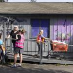 Volunteers prepare boxes for clients at the Faith Lutheran Food Bank on Friday, April 25, 2025, in Everett, Washington. (Olivia Vanni / The Herald)