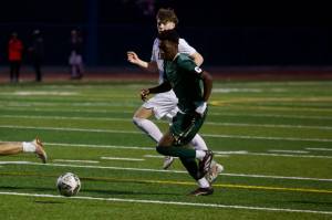 Marysville-Getchell senior Abdala Hassani dribbles upfield before scoring his first of two goals in the Chargers' 2-0 win against Snohomish in Marysville, Washington on April 25, 2025. (Joe Pohoryles / The Herald)