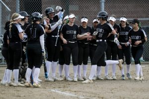 Jackson’s Allie Thomsen (22) celebrates a homerun during a prep softball game between Stanwood and Jackson at Henry M. Jackson High School on Tuesday, April 2, 2024 in Mill Creek, Washington. Jackson won, 6-0. (Annie Barker / The Herald)