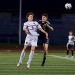Kamiak senior Yegor Tarasov (left) jumps to head the ball Lake Stevens senior Shad Schmitt tries to defend him during Kamiaks 2-1 win in Lake Stevens, Washington on April 29, 2025. (Joe Pohoryles / The Herald)