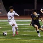 Kamiak freshman Jamil Badru (center left) protects the ball from Lake Stevens sophomore Isaiah Wheeler as Kamiak senior Carter Kjolso and Lake Stevens senior Parks Mickels watch the play unfold during Kamiaks 2-1 win in Lake Stevens, Washington on April 29, 2025. (Joe Pohoryles / The Herald)