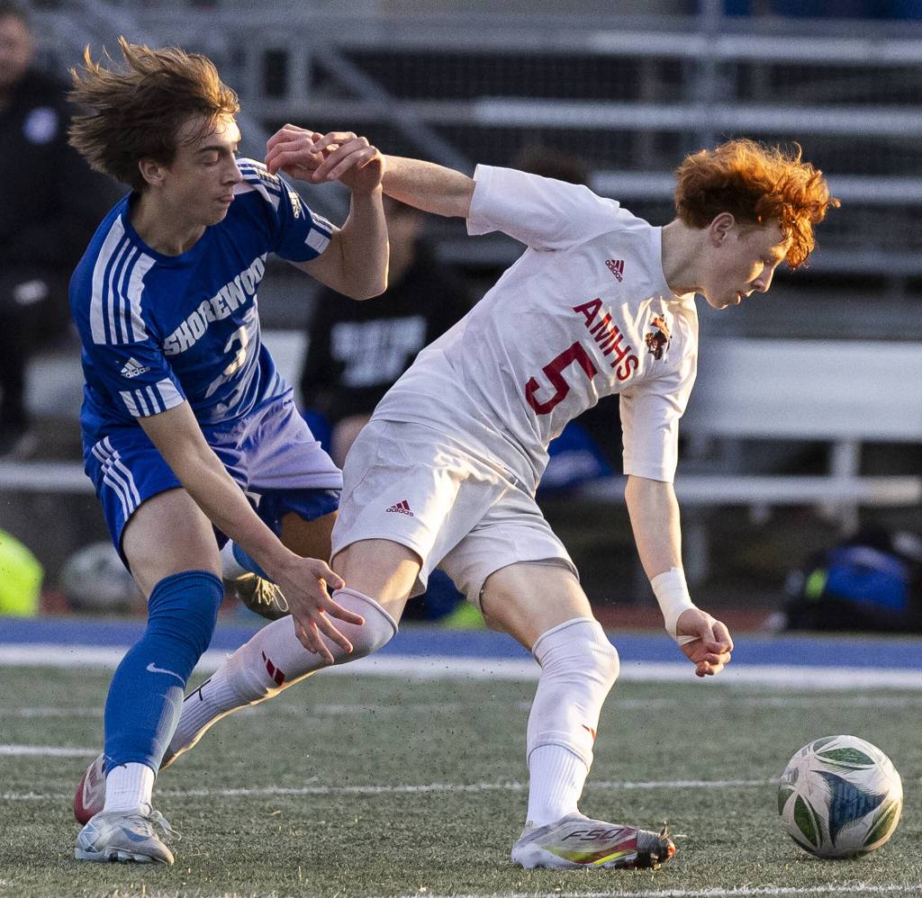Shorewoods Tally Lord runs after Archbishop Murphys Henry Fahey as he dribbles the ball downfield during the game on Wednesday, April 30, 2025 in Shoreline, Washington. (Olivia Vanni / The Herald)