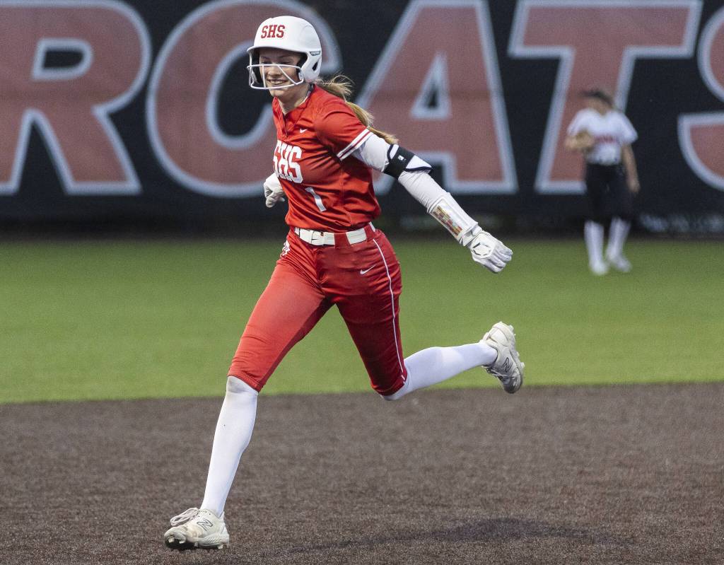Stanwoods Megan Stulc smiles as she runs the bases after hitting a home run in extra innings during the game against Monroe on Thursday, May 1, 2025 in Monroe, Washington. (Olivia Vanni / The Herald)