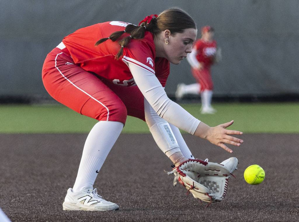 Stanwoods Addi Anderson picks up a bunt during the game against Monroe on Thursday, May 1, 2025 in Monroe, Washington. (Olivia Vanni / The Herald)