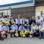 Everett postal workers gather for a portrait to advertise the Stamp Out Hunger Food Drive on Wednesday, May 7, 2025 in Everett, Washington. (Olivia Vanni / The Herald)