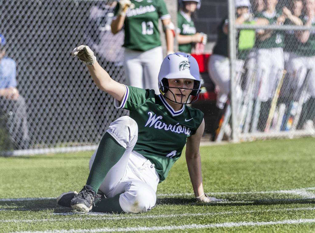Edmonds-Woodways Maddie Jones slides into home to score during the game against Archbishop Murphy on Monday, May 5, 2025 in Everett, Washington. (Olivia Vanni / The Herald)