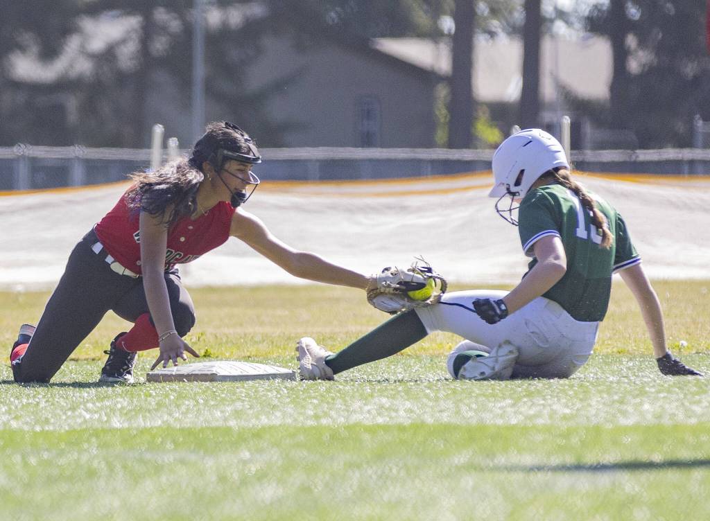 Archbishop Murphys Saylah Lopez tags Edmonds-Woodways Audrey Sommer as she slides into second base during the game on Monday, May 5, 2025 in Everett, Washington. (Olivia Vanni / The Herald)