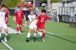Archbishop Murphy senior Ivan Juarez Oropeza contests with Anacortes senior Logan Baumgaertner for the ball during the Wildcats' 3-0 win in the District 1 2A Boys Soccer quarterfinals in Everett, Washington on May 8, 2025. (Joe Pohoryles / The Herald)