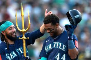 The Seattle Mariners' Julio Rodríguez (44) is congratulated by J.P. Crawford (3) after he hit a home run against the Athletics in the first inning at Sutter Health Park on Tuesday, May 6, 2025, in Sacramento, California. (Ezra Shaw / Getty Images / Tribune News Services)
