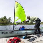 Kyle Parker shows a custom sail made for his canoe on Thursday, May 8, 2025 in Everett, Washington. (Olivia Vanni / The Herald)