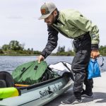 Kyle Parker shows some of the items he has packed into his canoe for his cross county trip on Thursday, May 8, 2025 in Everett, Washington. (Olivia Vanni / The Herald)