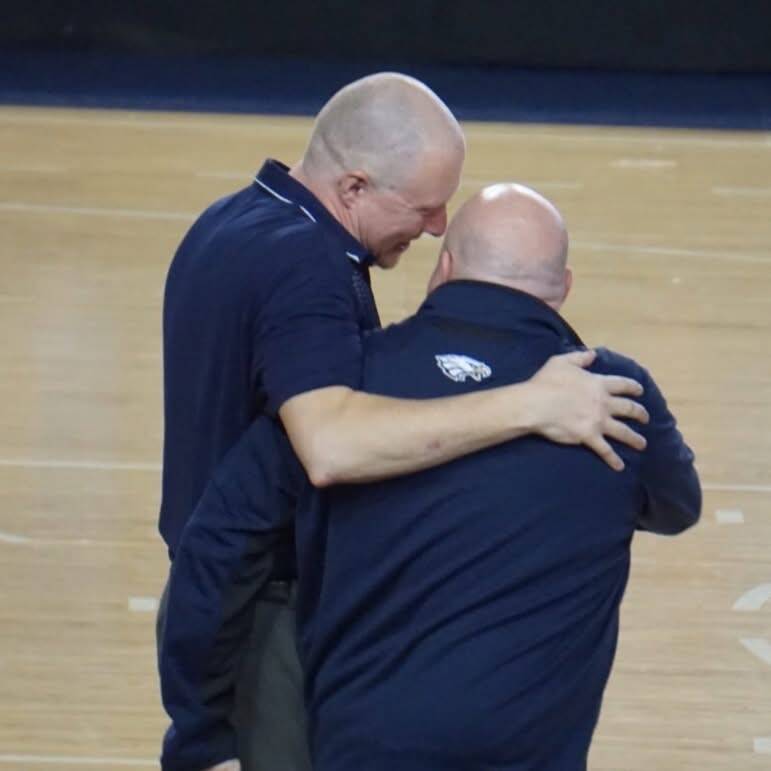 Arlington girls head basketball coach Joe Marsh (left) walks with his brother and assistant coach Sean Marsh after a game. (Photo courtesy of Sean Marsh)