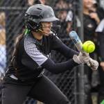 Jackson’s Kiana Holden bunts the ball during the 4A district championship against Kamiak on Friday, May 17, 2024 in Everett, Washington. (Olivia Vanni / The Herald)