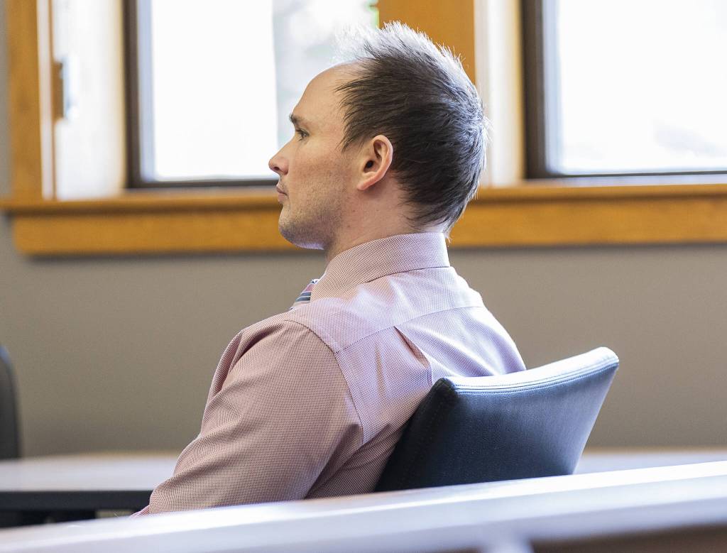 Christian Sayre listens to closing statements during his trial at the Snohomish County Courthouse on Thursday in Everett. (Olivia Vanni / The Herald)