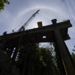 A crane maneuvers parts of a timber mat on Friday, May 9, 2025 in Everett, Washington. (Olivia Vanni / The Herald)