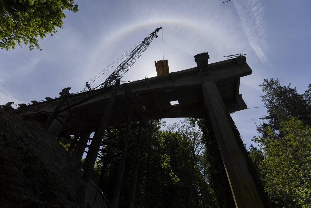 A crane maneuvers parts of a timber mat on Friday, May 9, 2025 in Everett, Washington. (Olivia Vanni / The Herald)