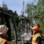 City of Everett Engineer Tom Hood, left, and City of Everett Engineer and Project Manager Dan Enrico, right, talks about the current Edgewater Bridge demolition on Friday, May 9, 2025 in Everett, Washington. (Olivia Vanni / The Herald)