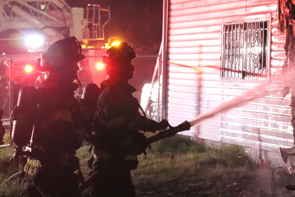Everett firefighters extinguish an apartment fire early Friday morning in the Pinehurst neighborhood. (Everett Fire Department)