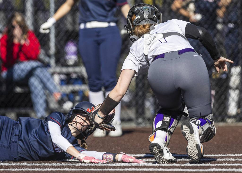 Lake Stevens Alaina Emme gets a tag for an out at home plate during the game against Juanita on Monday, May 12, 2025 in Everett, Washington. (Olivia Vanni / The Herald)