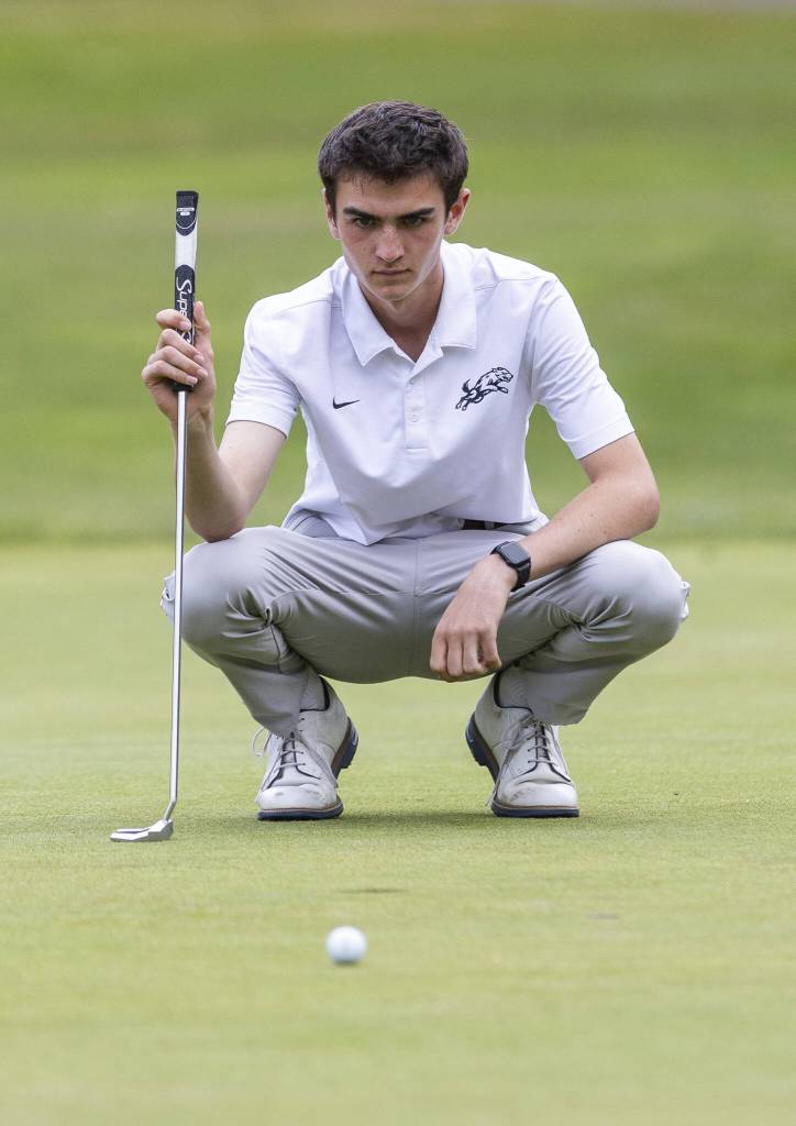 Jacksons Henry Kippenhan lines up his putt during the 4A District 1 Boys Golf Championship at Legion Memorial Golf Course on Tuesday, May 13, 2025 in Everett, Washington. (Olivia Vanni / The Herald)