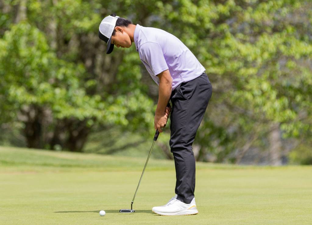 Kamiaks Tristan Kim putts during the 4A District 1 Boys Golf Championship at Legion Memorial Golf Course on Tuesday, May 13, 2025 in Everett, Washington. (Olivia Vanni / The Herald)