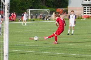 Archbishop Murphy senior Zach Mohr sends a penalty kick into the bottom right corner to give the Wildcats a 2-0 lead in the final minutes of the first half against Anacortes during their 3-0 win in the District 1 2A Boys Soccer quarterfinals in Everett, Washington on May 8, 2025. (Joe Pohoryles / The Herald)