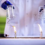 A standard jet fuel, left, burns with extensive smoke output while a 50 percent SAF drop-in jet fuel, right, puts off less smoke during a demonstration of the difference in fuel emissions on Tuesday, March 28, 2023 in Everett, Washington. (Olivia Vanni / The Herald)