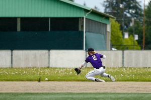Lake Stevens shortstop Aspen Alexander nearly makes a sliding play in the field during a playoff loss to Bothell on Saturday, May 4, 2024, in Lake Stevens, Washington. (Ryan Berry / The Herald)