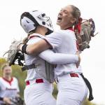 Snohomishs Abby Edwards hugs her teammate after beating Edmonds-Woodway in the 3A District 1 consolation game on Thursday, May 15, 2025 in Snohomish, Washington. (Olivia Vanni / The Herald)