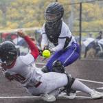 Edmonds-Woodways Abby McCorvey bobbles the ball as Snohomishs Amelie Lopez slides into her as tries to get to home plate during the 3A District 1 consolation game on Thursday, May 15, 2025 in Snohomish, Washington. (Olivia Vanni / The Herald)