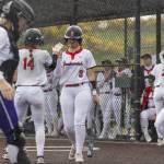 Snohomishs Madalynn Larsen high-fives Abby Edwards as she walks up to bat during the 3A District 1 consolation game against Edmonds-Woodway on Thursday, May 15, 2025 in Snohomish, Washington. (Olivia Vanni / The Herald)