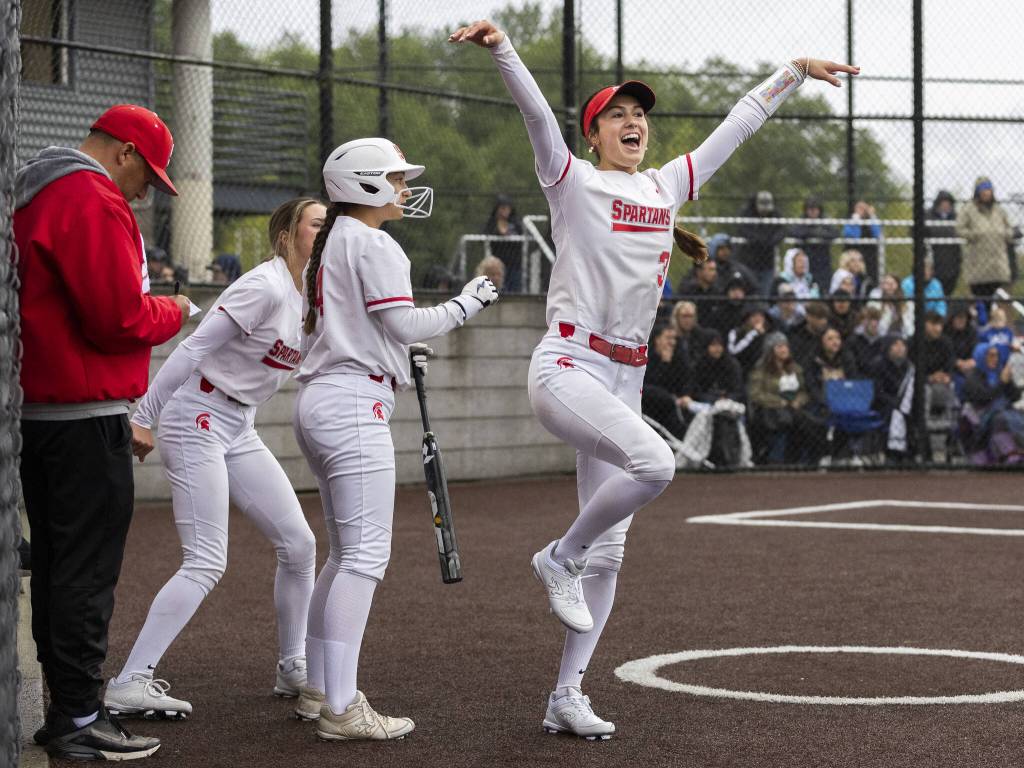 Stanwoods Rubi Lopez celebrates after her teammates base hit during the 3A District 1 championship game against Sedro-Woolley on Thursday, May 15, 2025 in Everett, Washington. (Olivia Vanni / The Herald)