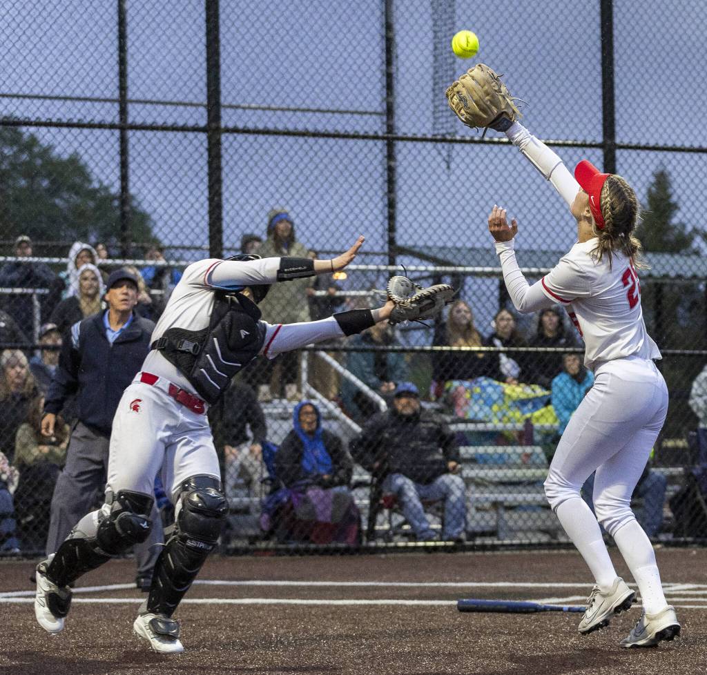 Stanwoods Jordan Rancourt and Reagan Ryan both run after a pop up during the 3A District 1 championship game against Sedro-Woolley on Thursday, May 15, 2025 in Everett, Washington. (Olivia Vanni / The Herald)