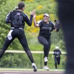 Jacksons Matea Lopez and Allie Thomsen leap in the air and high five during the 4A District 1 game against Lake Stevens on Friday, May 16, 2025 in Everett, Washington. (Olivia Vanni / The Herald)