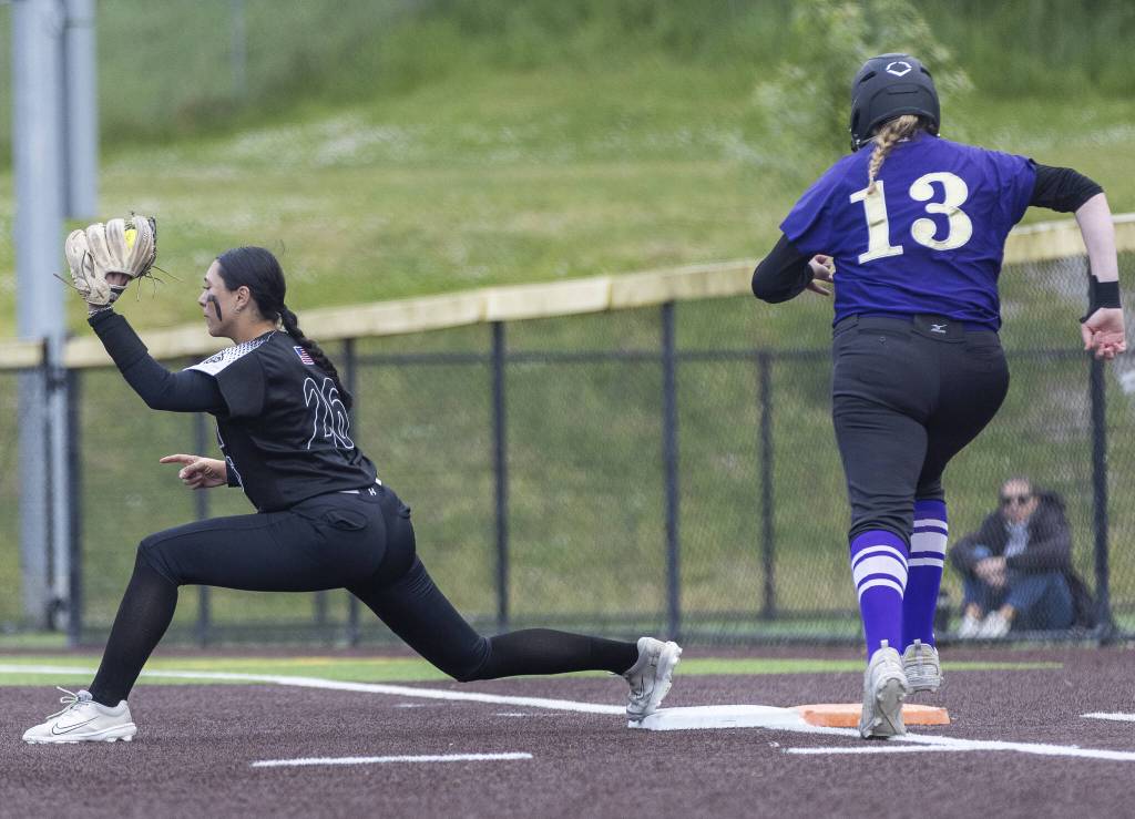 Jacksons Alana Banog gets an out at first base during the 4A District 1 game against Lake Stevens on Friday, May 16, 2025 in Everett, Washington. (Olivia Vanni / The Herald)