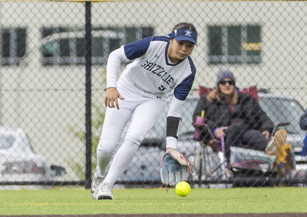 Glacier Peaks Samantha Christensen fields a ball in the outfield during the 4A District 1 consolation game against North Creek on Friday, May 16, 2025 in Everett, Washington. (Olivia Vanni / The Herald)