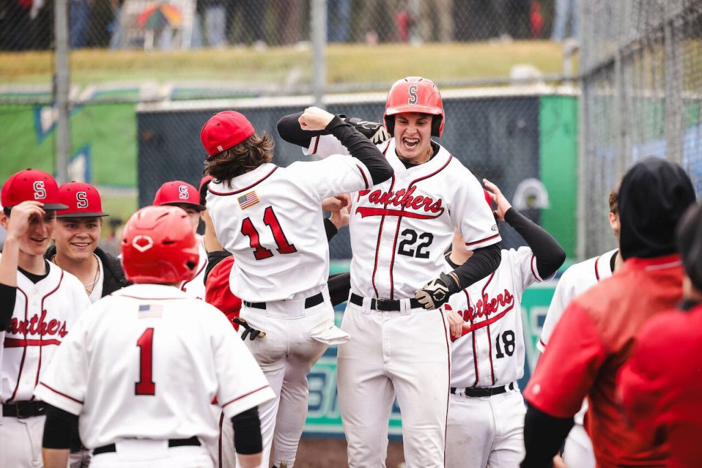 Snohomish sophomore Deyton Wheat (22) celebrates his go-ahead, three-run home run with senior Brayden Holscher (11) during the Panthers 4-2 win against Monroe in a District 1 3A consolation game in Woodinville, Washington on May 17, 2025. (Photo courtesy of Brea Bursch / Snohomish Baseball)