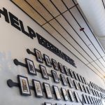 Photographs of employees hang on the wall inside the employee entrance of the new Snohomish County 911 building on Tuesday, May 20, 2025, in Everett, Washington. (Olivia Vanni / The Herald)