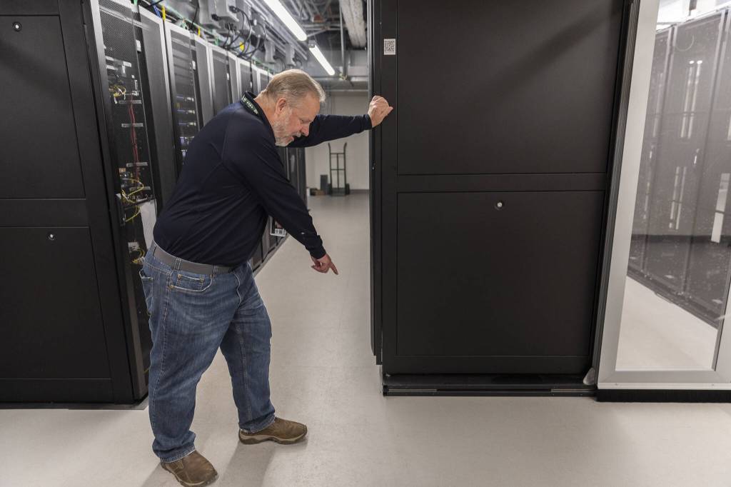 Snohomish County 911 Executive Director Kurt Mills shows some of the earthquake preparedness adaptations made in the server room of the new Snohomish County 911 building on Tuesday, May 20, 2025 in Everett, Washington. (Olivia Vanni / The Herald)