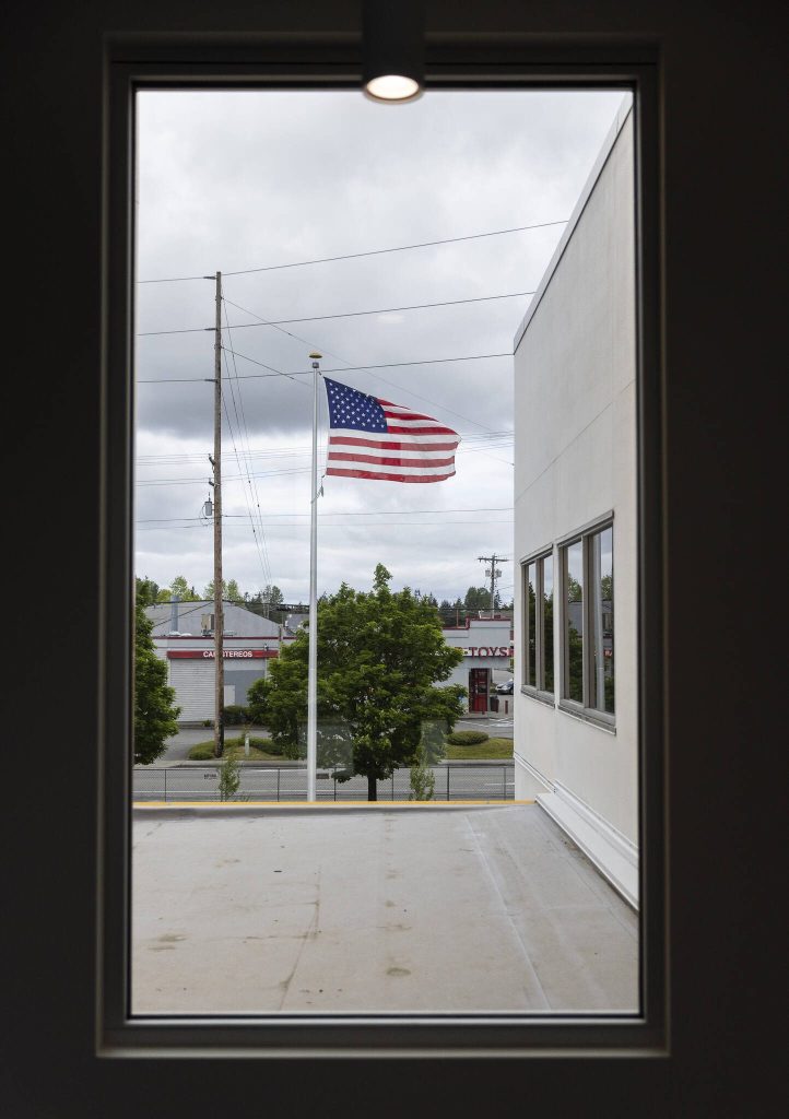 An American flag flies outside of the new Snohomish County 911 building on Tuesday, May 20, 2025 in Everett, Washington. (Olivia Vanni / The Herald)