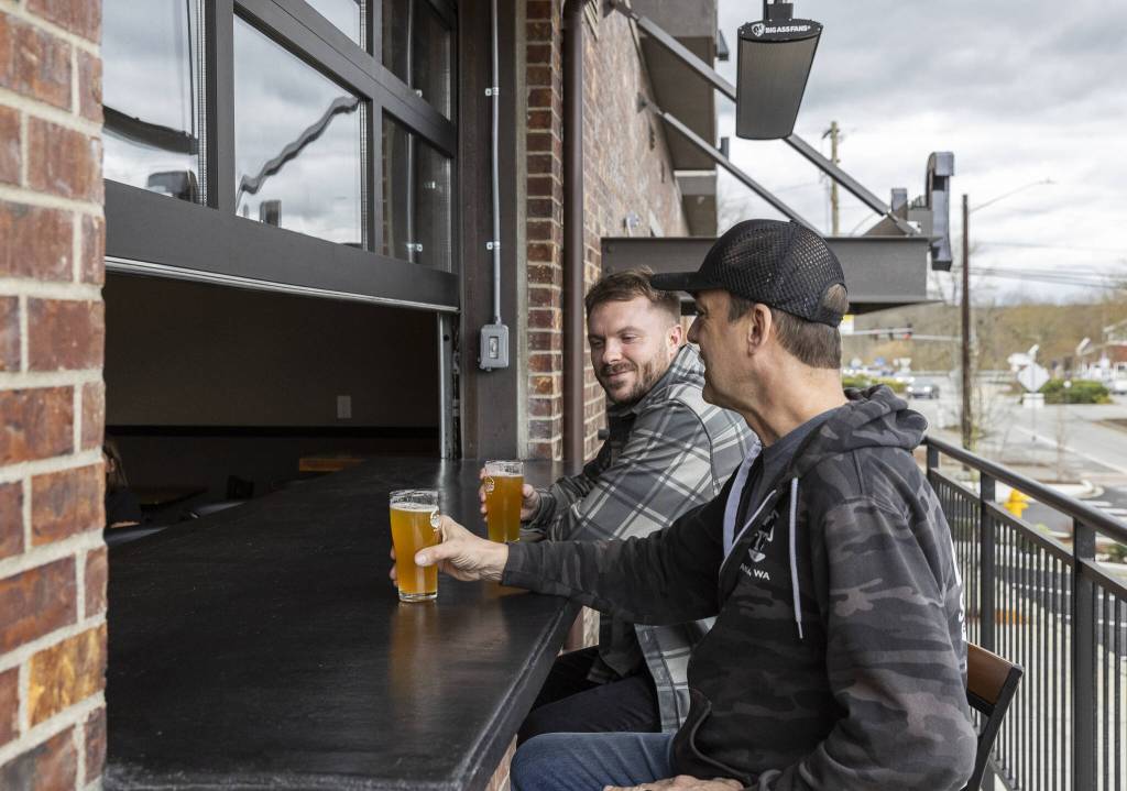 Cole Rinehardt sits in the outside area at In The Shadow Brewing on Wednesday, March 12, 2025 in Arlington, Washington. (Olivia Vanni / The Herald)