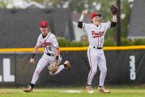 Snohomish’s Griffin Triggs and Chase Clark celebrate getting the final out to beat Bellevue in loser-out opening round 3A state game on Tuesday, May 20, 2025 in Snohomish, Washington. (Olivia Vanni / The Herald)